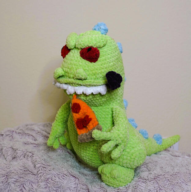 reptar eating pizza with tongue out