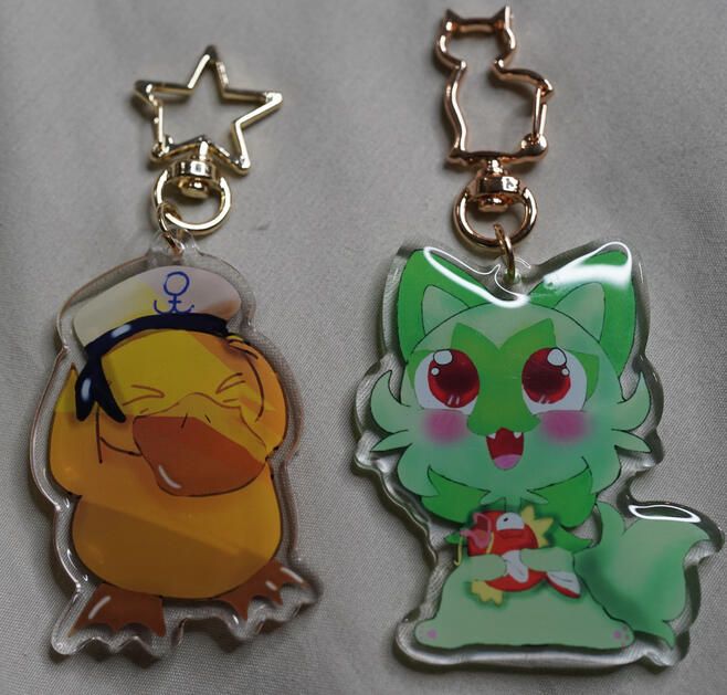 Psyduck and Sprigatito keychains
